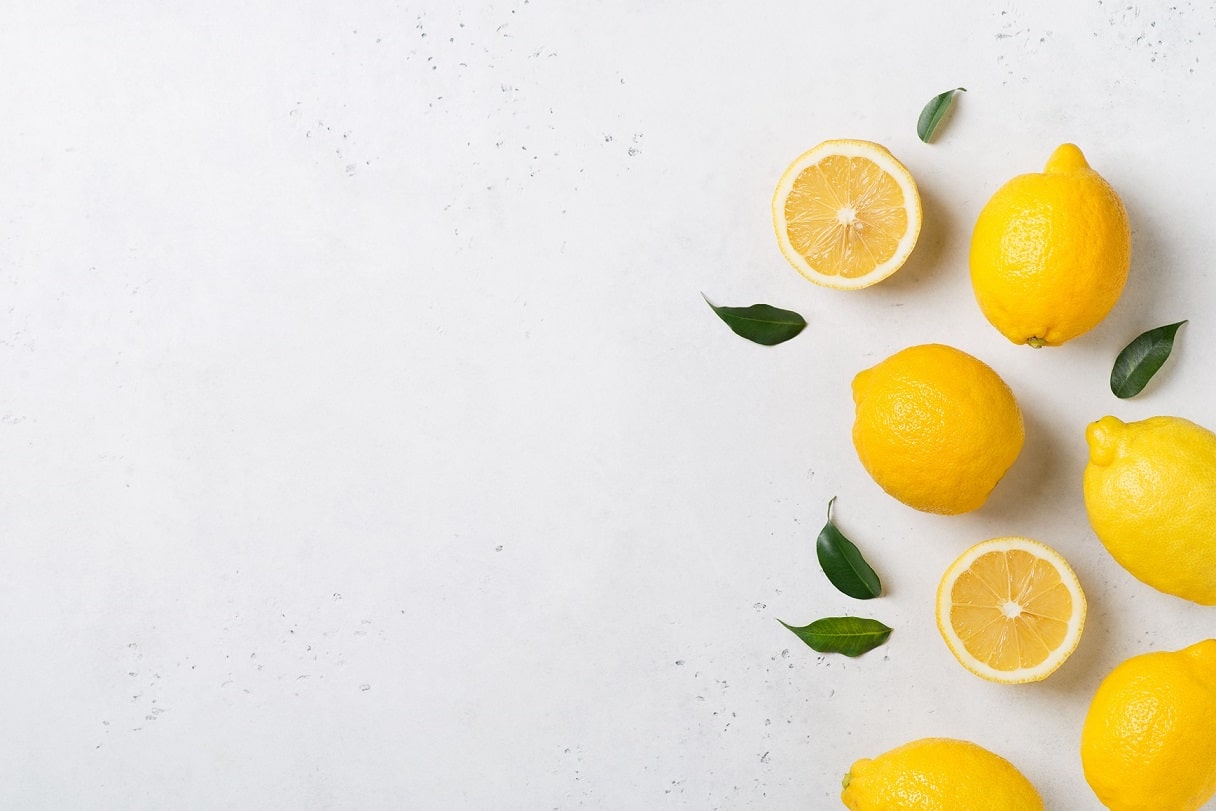 Ripe,Lemons,Flat,Lay,With,Leaves,On,White,Background